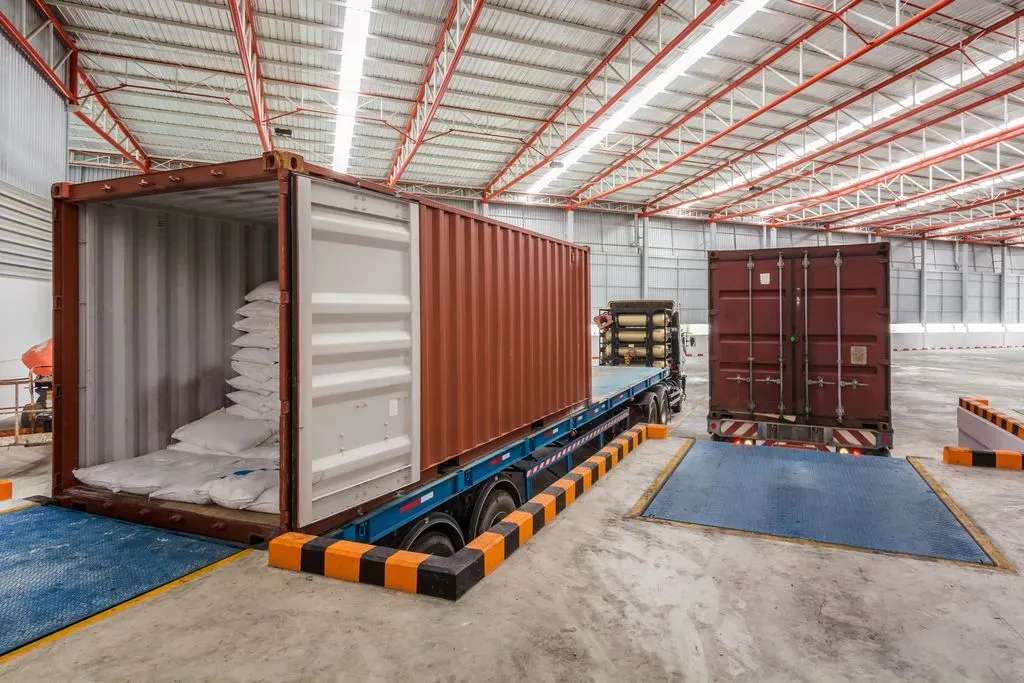 Warehouse Container Unload Shutterstock 426933001
